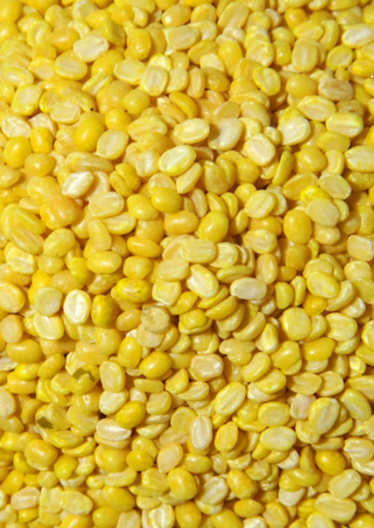 Close up photo of yellow moong / mung lentils / dal