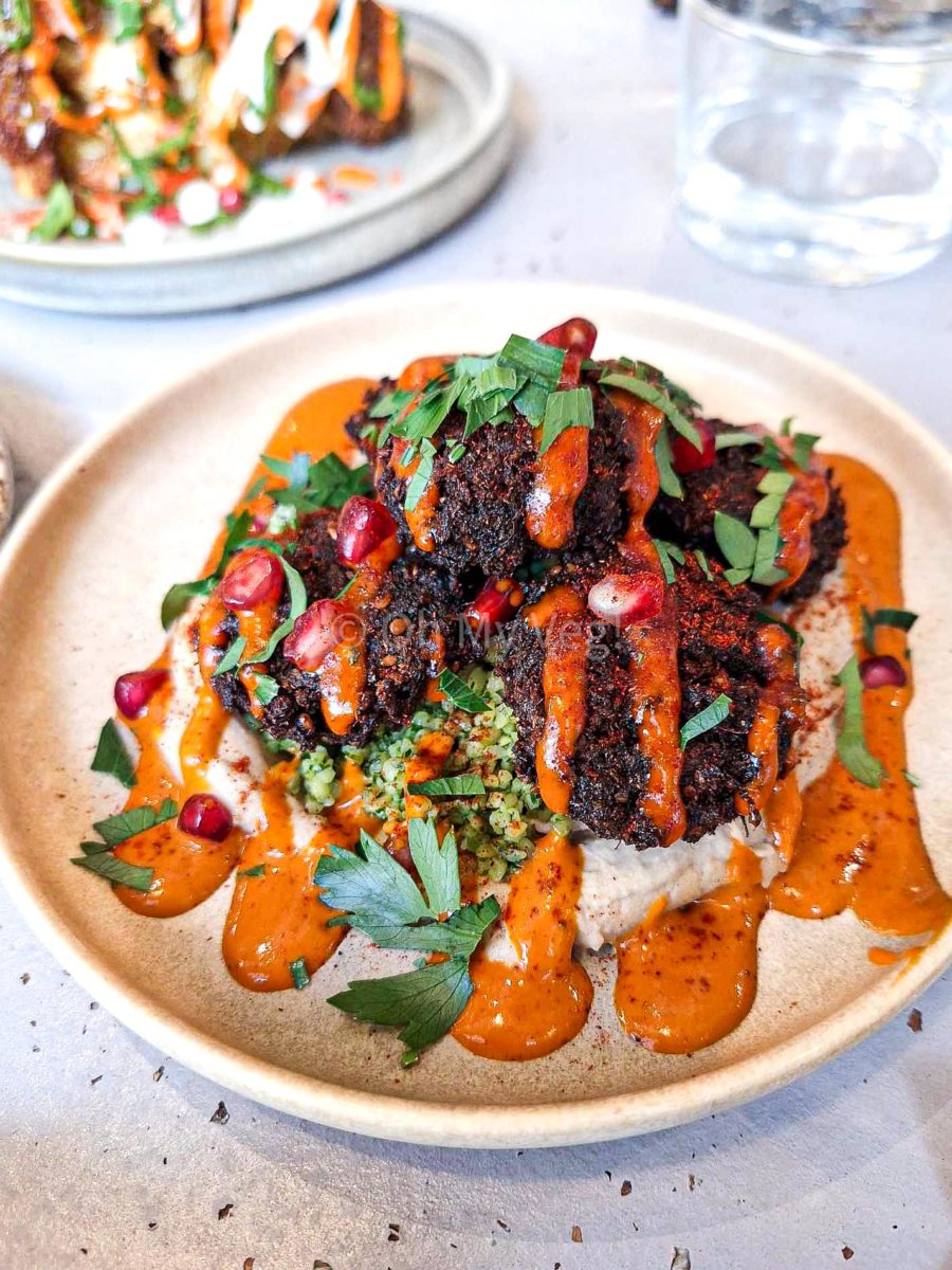 Maray falafels with hummus, tabouleh, and harissa sauce. 