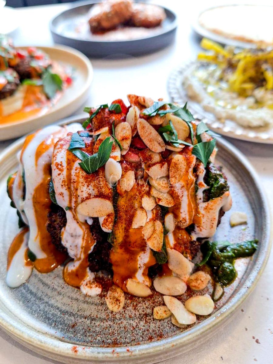 Maray Manchester disco cauliflower topped with tahini, harissa, chermoula, and almonds. 