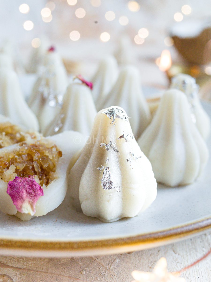 Close up of ukadiche modak on a white plate.