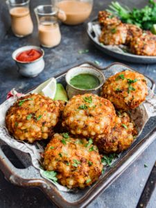 Sabudana vada with ketchup, green chutney, and masala chai