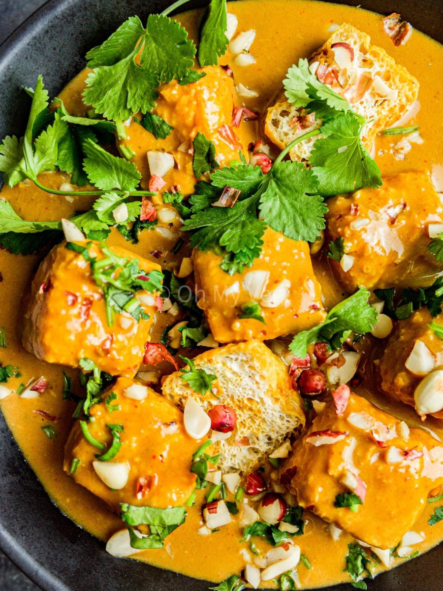 Vegan tofu satay curry topped with coriander and peanuts.