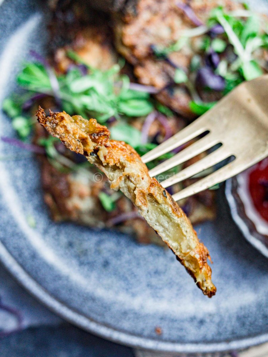 A piece of tender eggplant omelet on a fork.