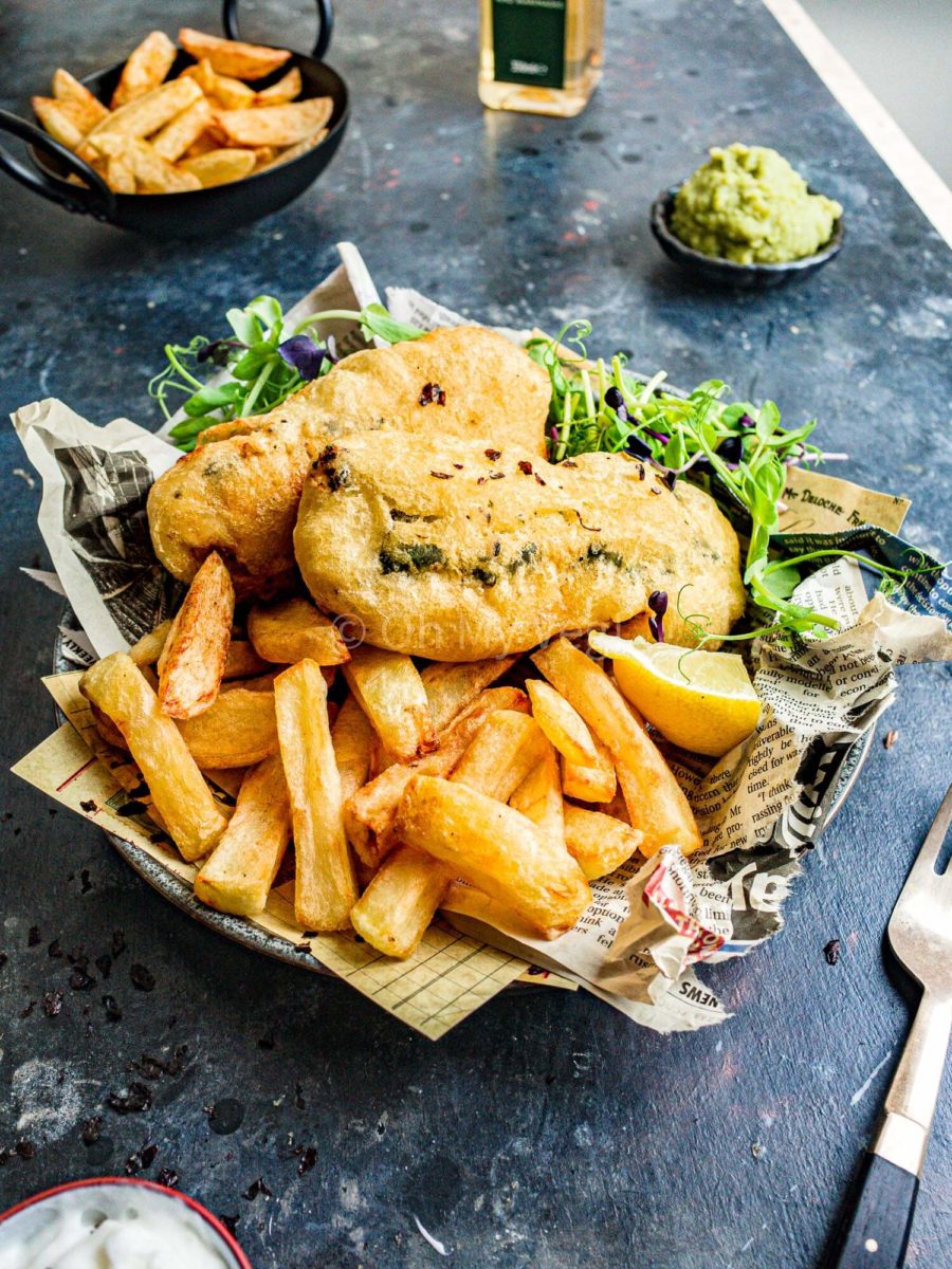 Vegan fish and chips with battered tofu, chips, and salad. 