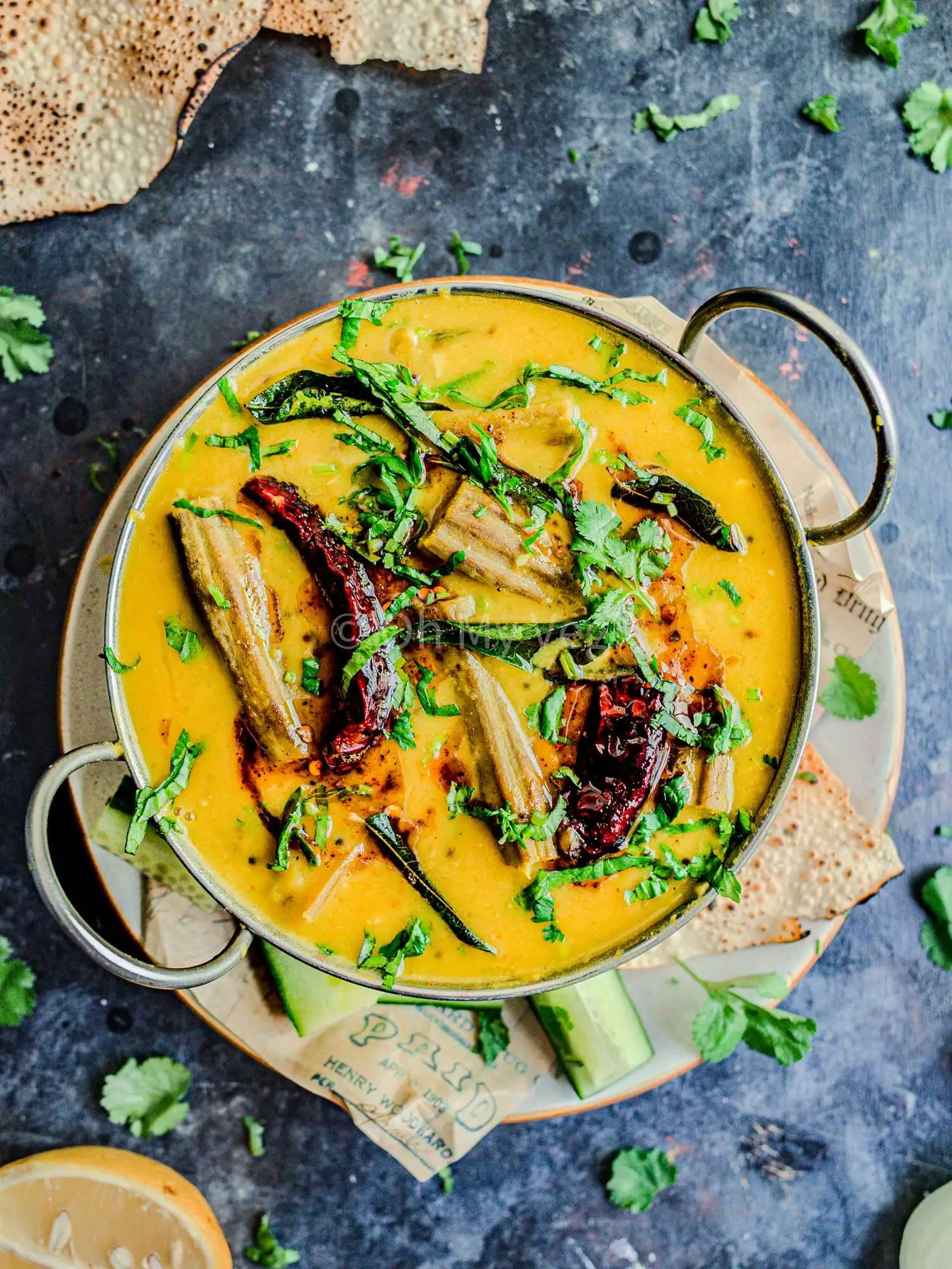 Drumstick dal in a metal bowl.