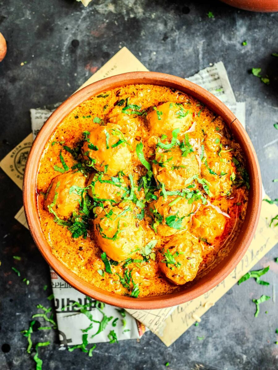 Spicy red dum aloo curry in a bowl. 