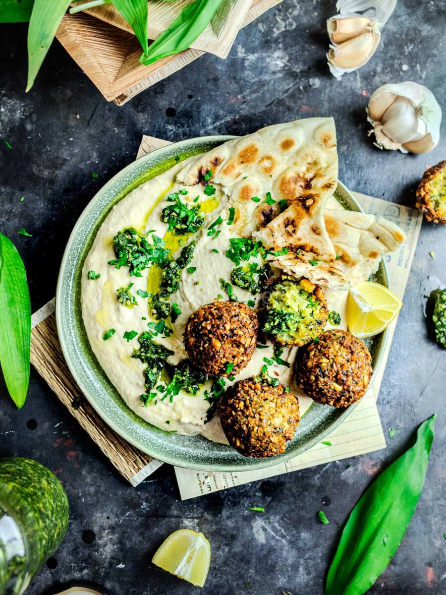 Wild garlic falafel on a bed of hummus with naan. 