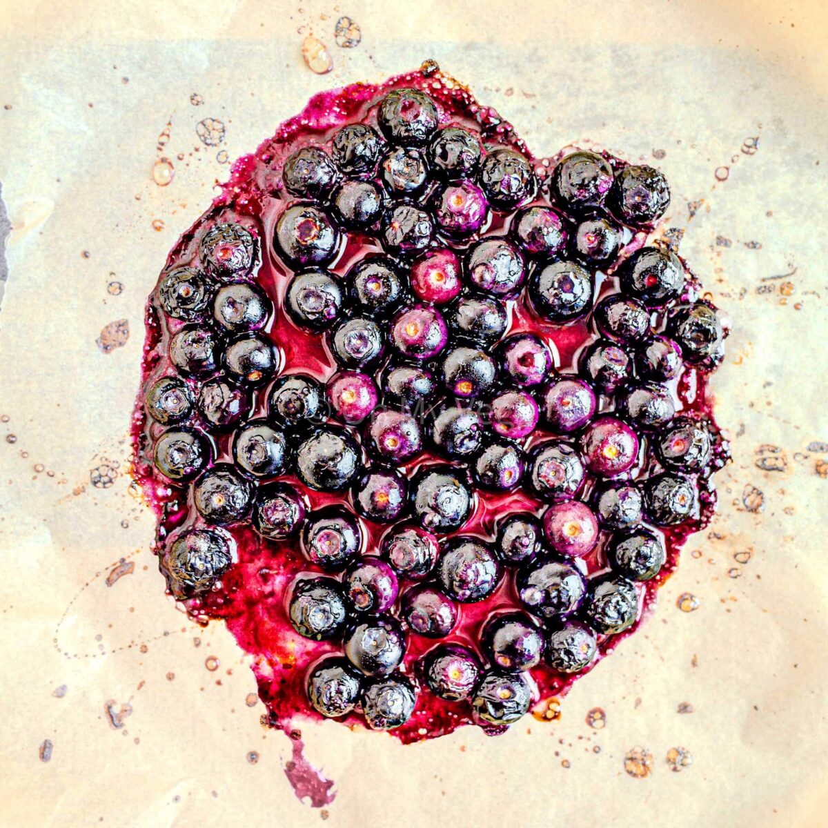 Cooked blueberries with the juices coming out.