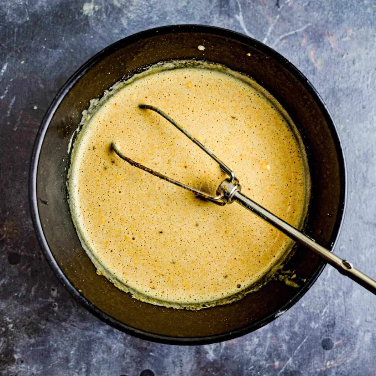 Chickpea flour and water in a bowl.