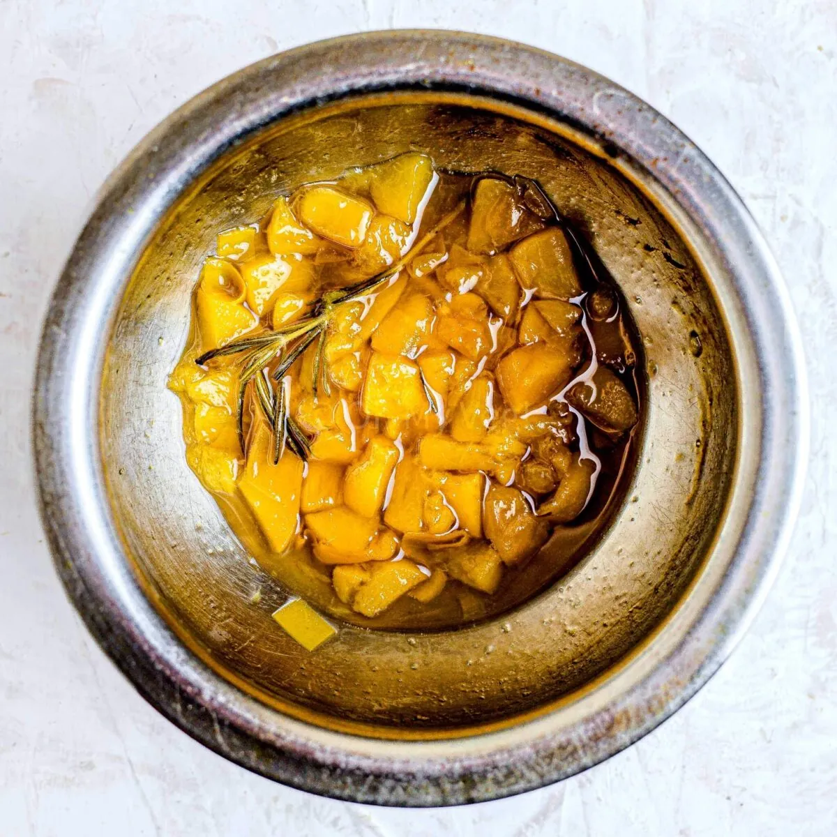 Peach syrup in pan.