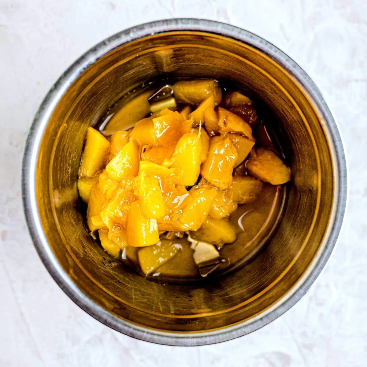Cooked peaches in blender.
