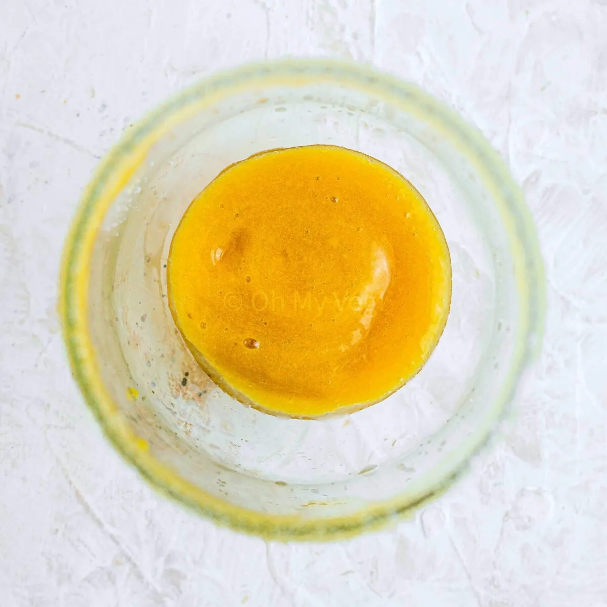Peach puree in glass.