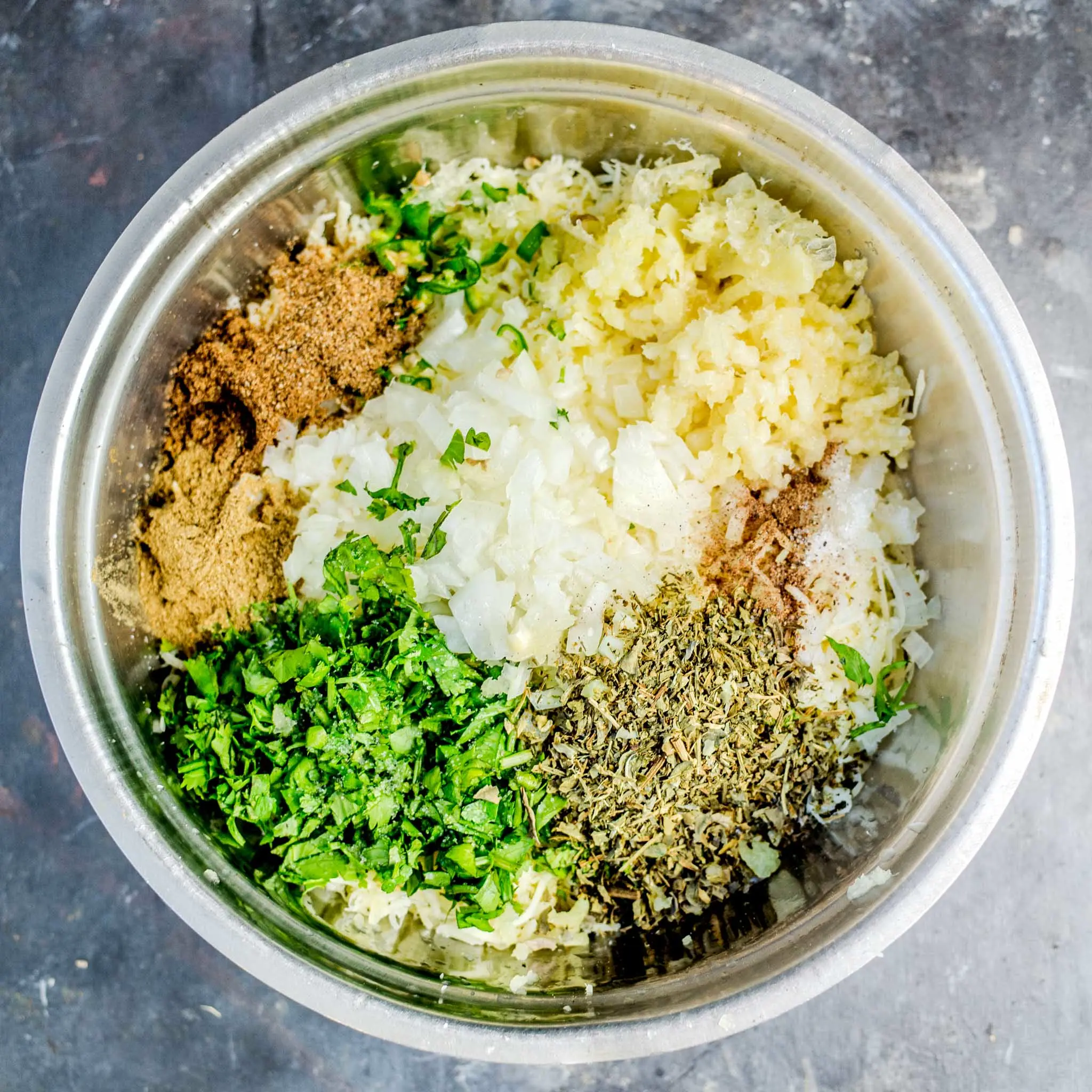 Ingredients for paneer stuffing in a bowl.