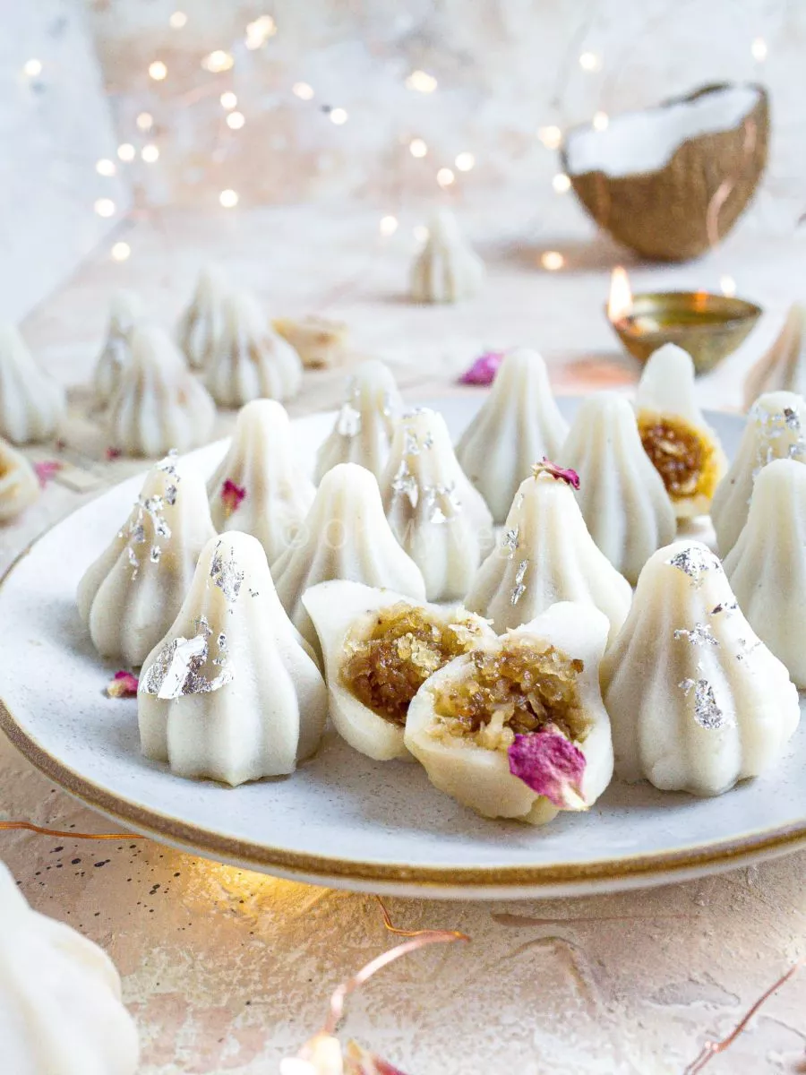 Steamed modak on a plate.