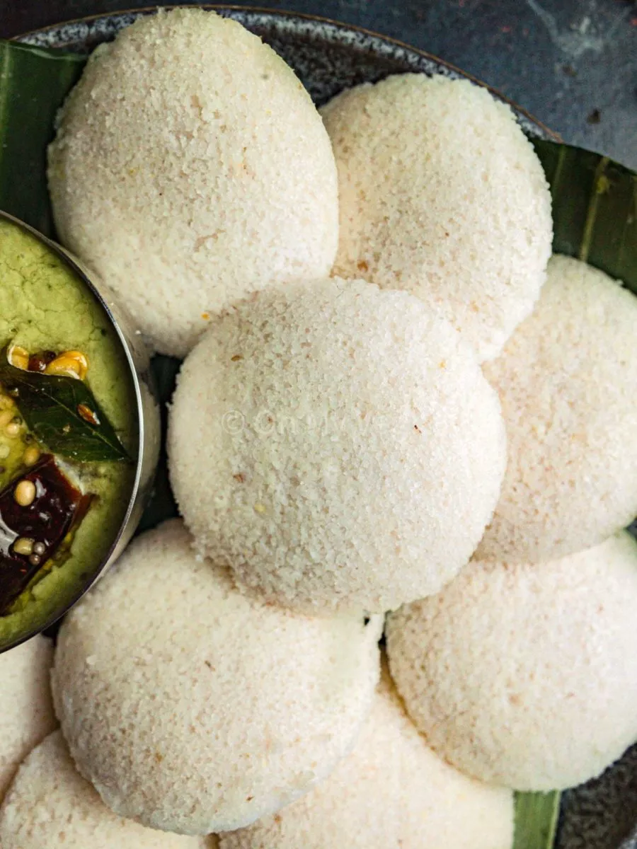 Close up of fluffy soft idli on a plate.