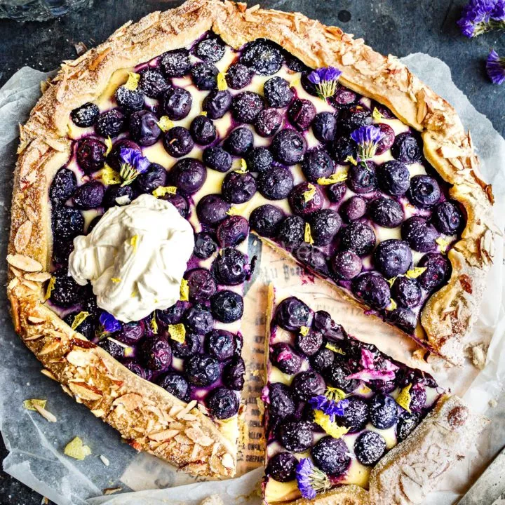 Blueberry cheesecake galette with cream.