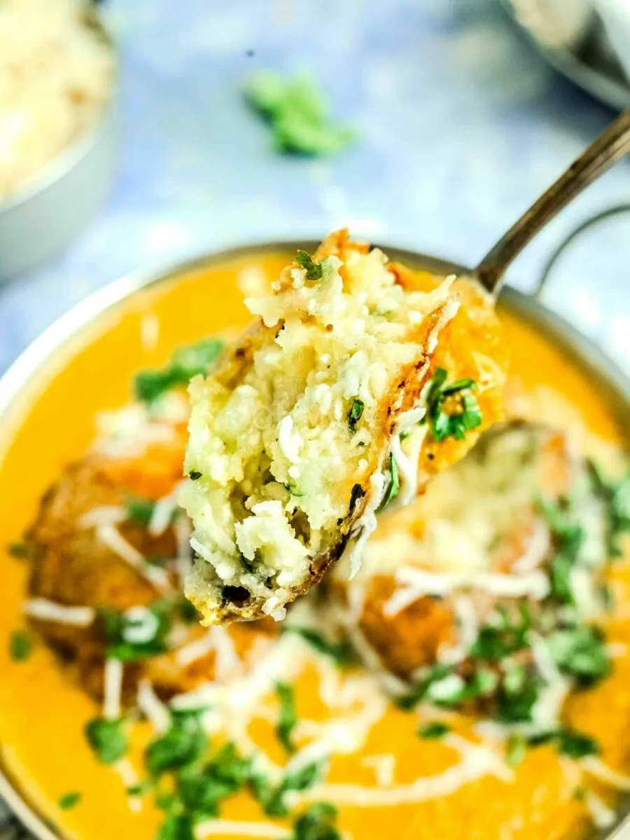 Aloo and paneer kofta close up from inside.