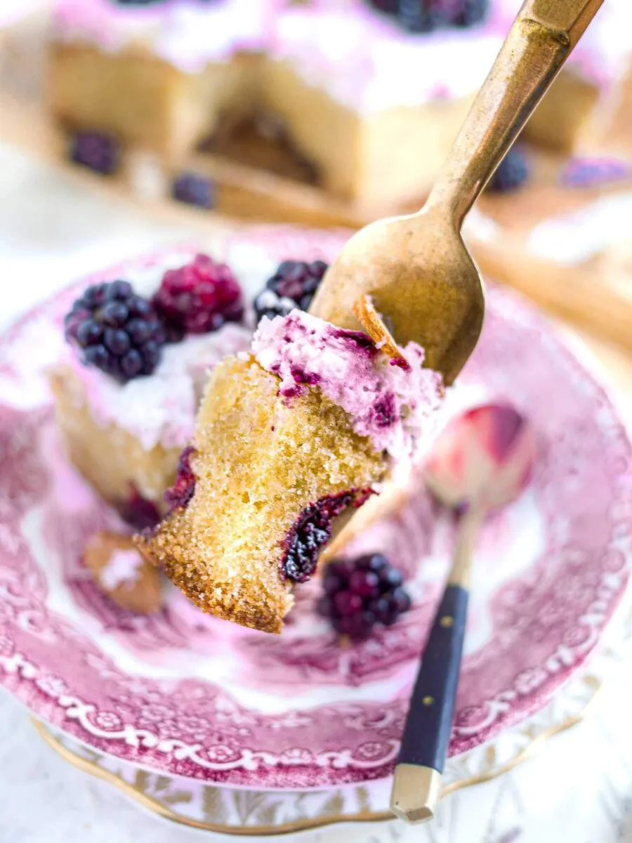 Fork with a piece of blackberry cake on it.