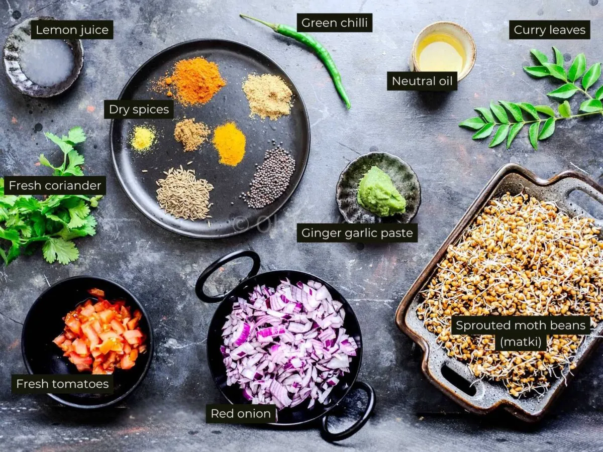 Ingredients for matki usal, on a black background.