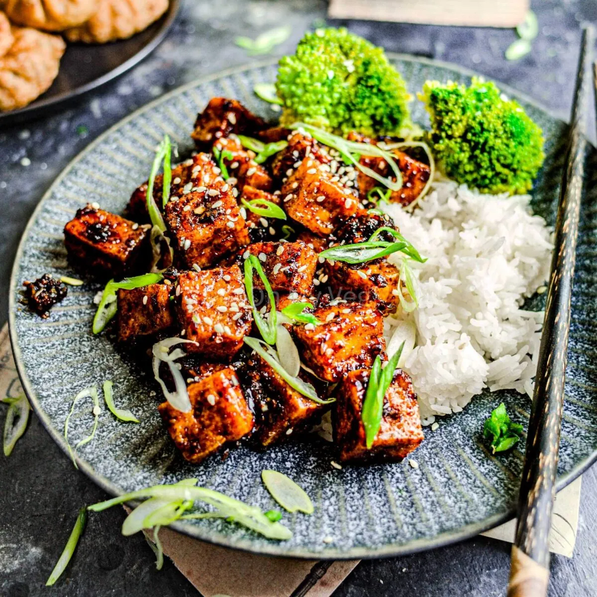 Honey garlic tofu with rice and broccoli.