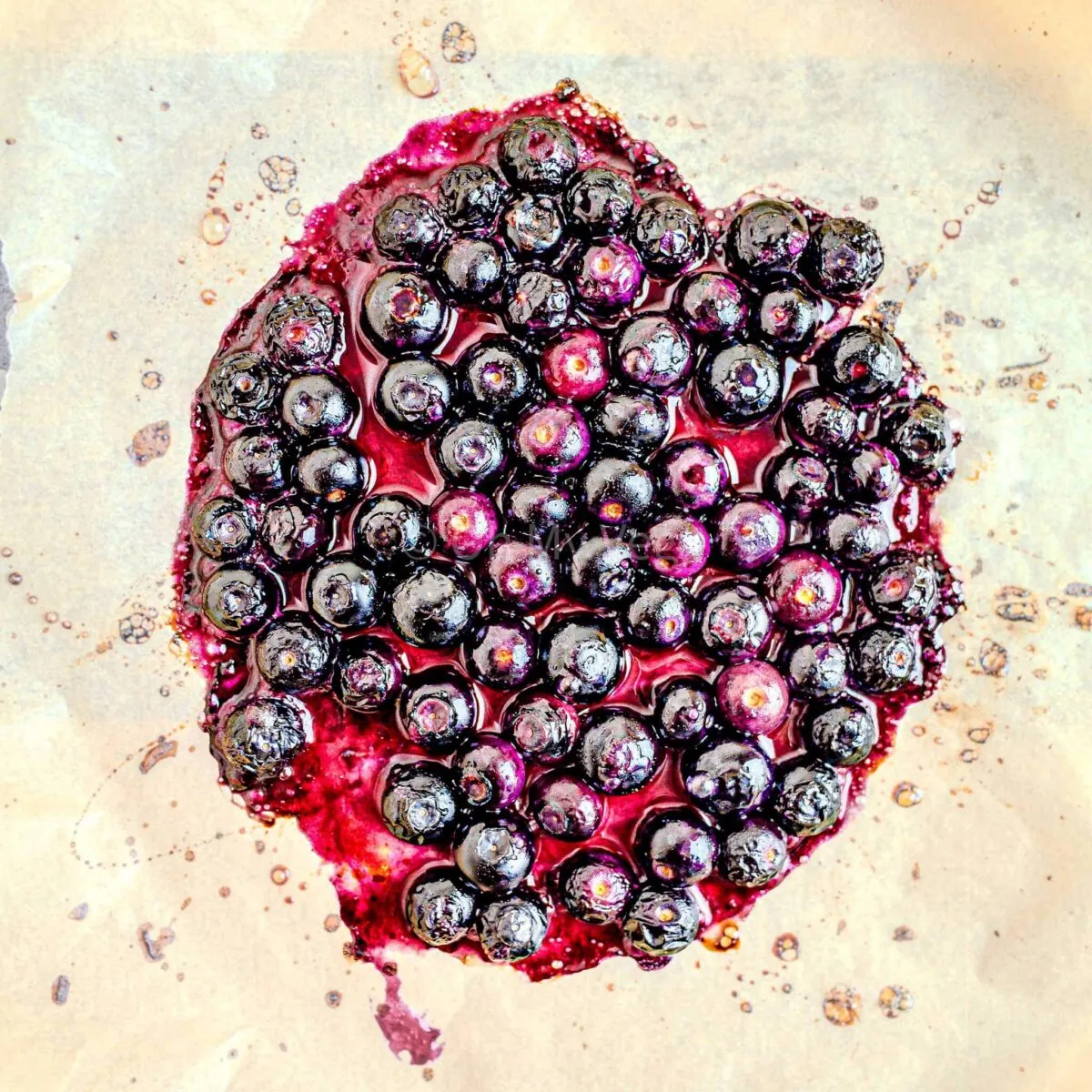 Cooked blueberries with the juices coming out.