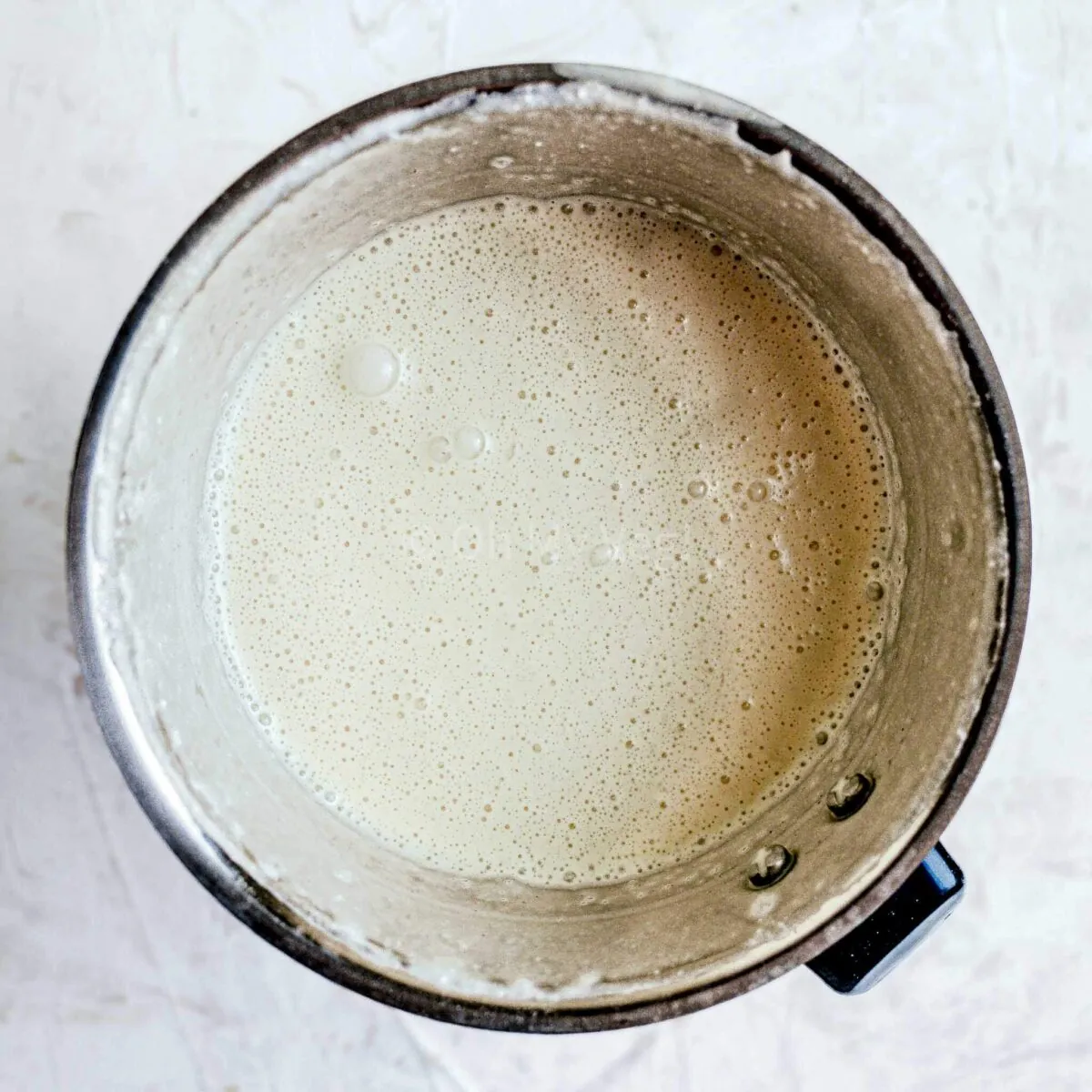 Blended coconut milk crepe batter.