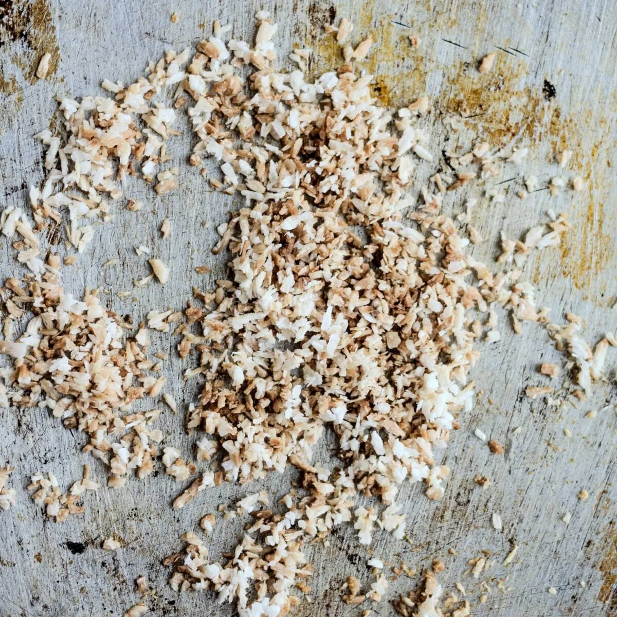 Toasted and browned desiccated coconut.
