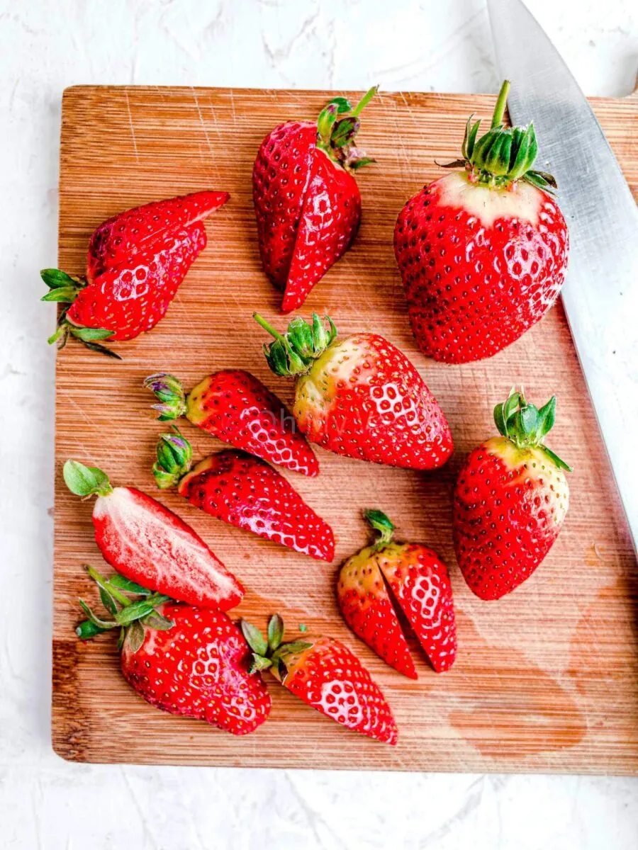 Strawberries on a chopping board.