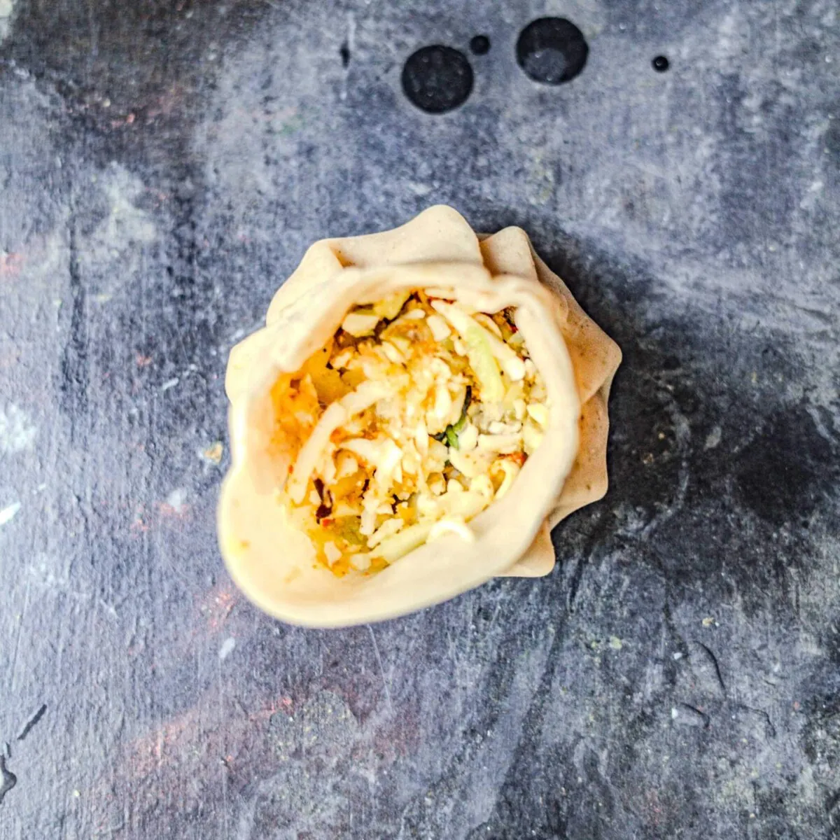Pleating paneer momos.