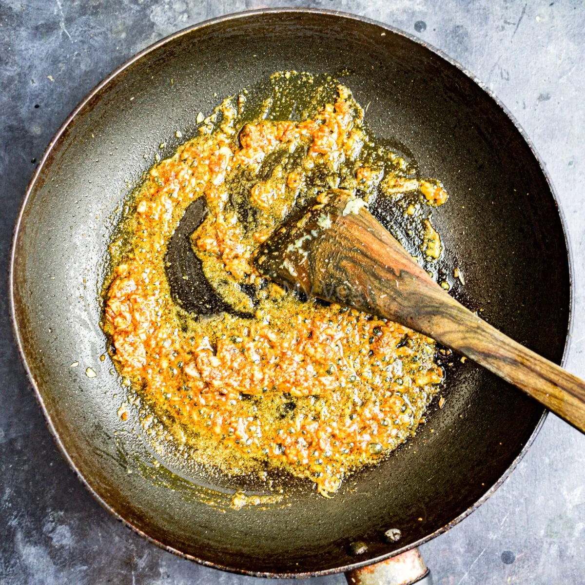 Spices frying in oil.