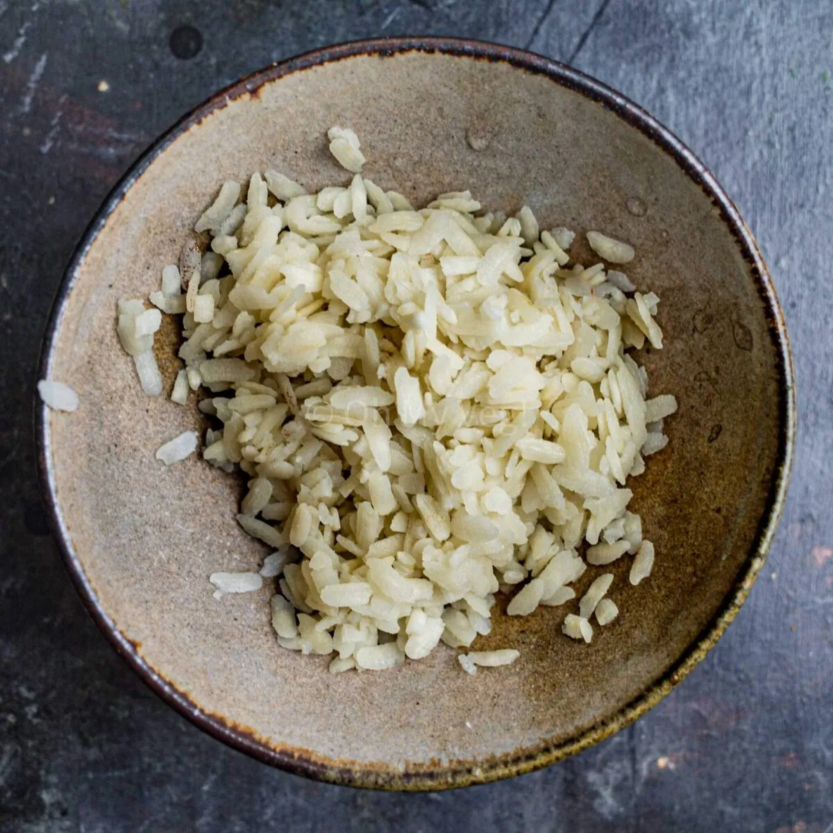 Soaked and drained poha in a bowl.