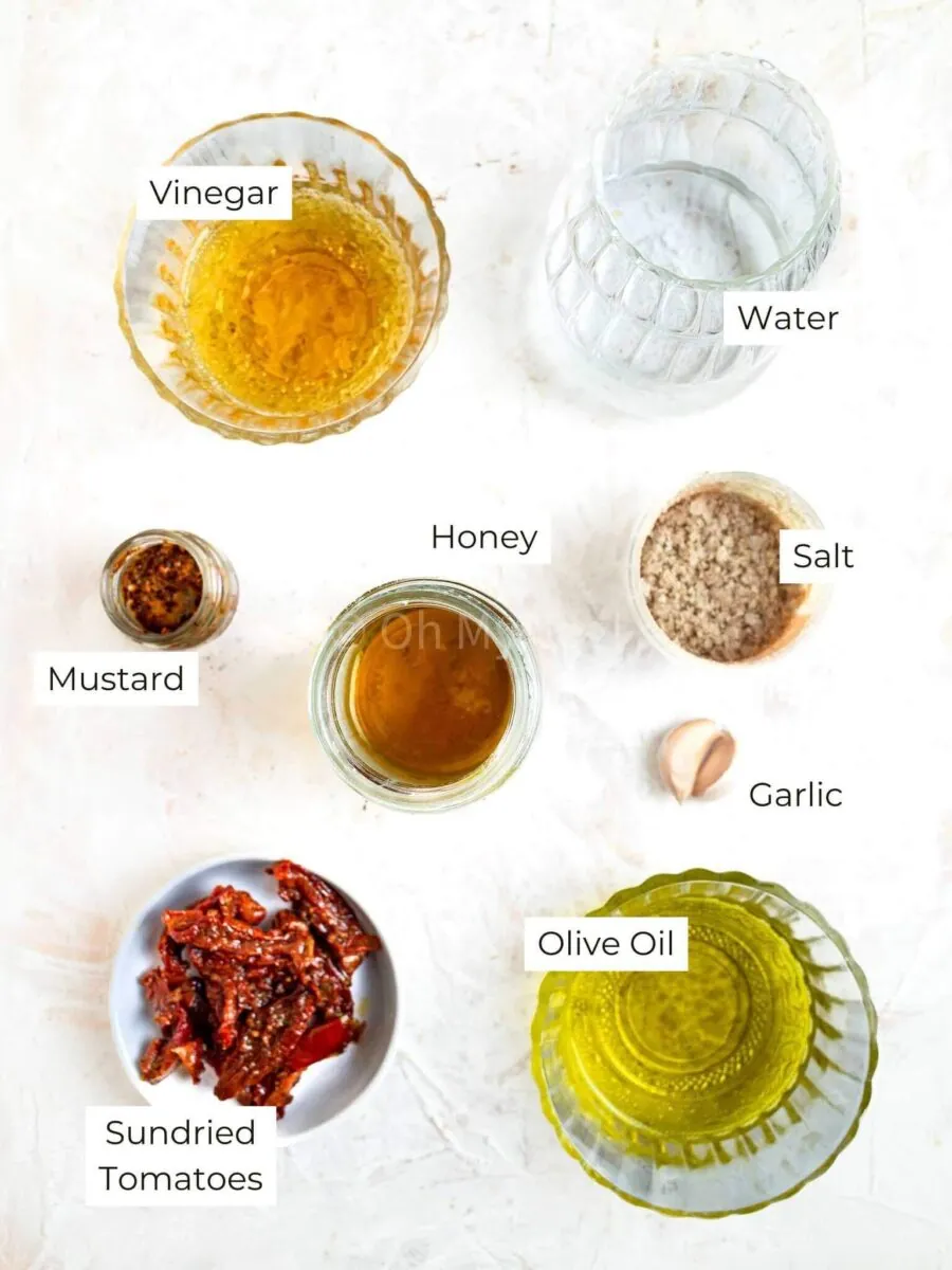Ingredients for sun dried tomato vinaigrette with text labels