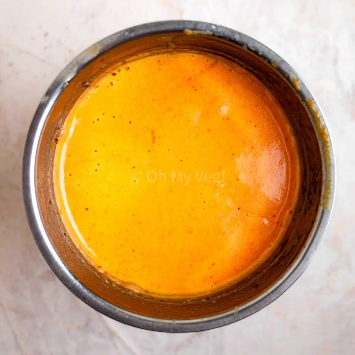 Blended smooth sun dried tomato dressing.